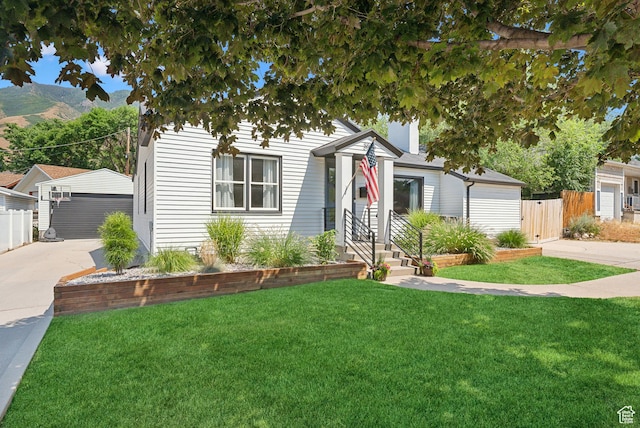 view of front of house with an outbuilding and a mountain view