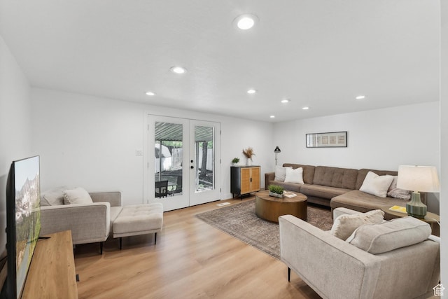 living area with recessed lighting, light wood-type flooring, and french doors