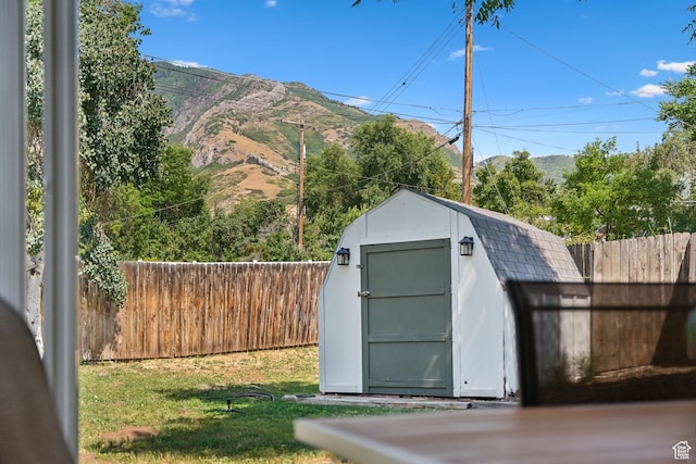 view of shed featuring a mountain view