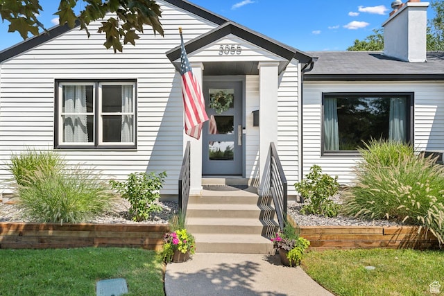view of front of property featuring a chimney