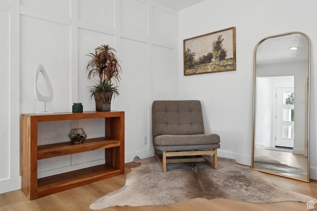 sitting room featuring wood finished floors