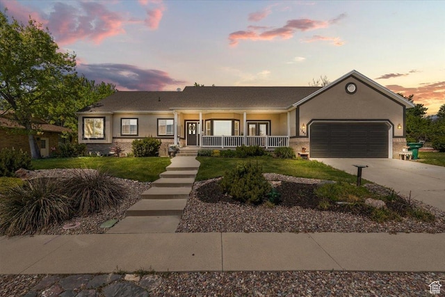 1243 E 1450 N, Lehi, UT 84043 - single story home with a porch, a garage, driveway, and stucco siding