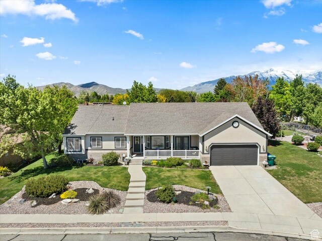 1243 E 1450 N, Lehi, UT 84043 - single story home with covered porch, an attached garage, a front yard, and a mountain view