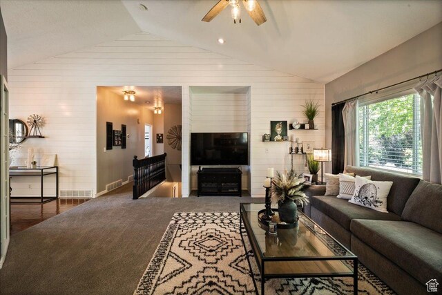 1243 E 1450 N, Lehi, UT 84043 - living area with vaulted ceiling, wooden walls, ceiling fan, carpet floors, and baseboards