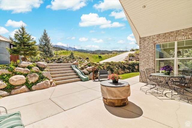 view of patio / terrace featuring a mountain view