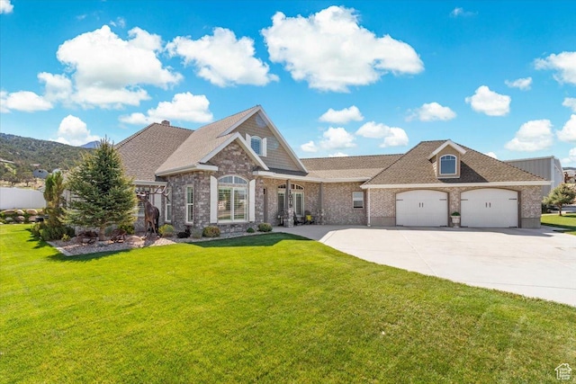 view of front of house featuring concrete driveway, an attached garage, a front yard, and brick siding