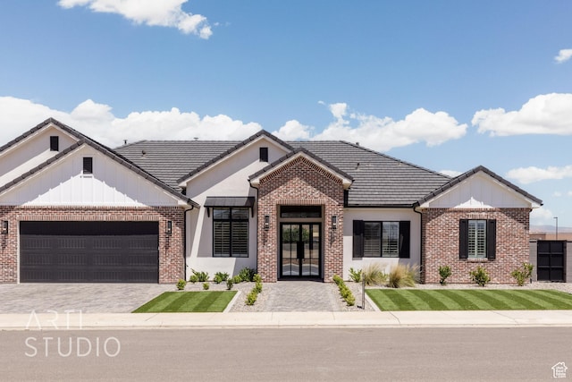 657 E Royal Dr, Washington, UT 84780 - view of front of home with brick siding, french doors, and an attached garage