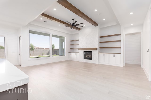 657 E Royal Dr, Washington, UT 84780 - unfurnished living room featuring healthy amount of natural light, ceiling fan, light wood-type flooring, recessed lighting, and a fireplace