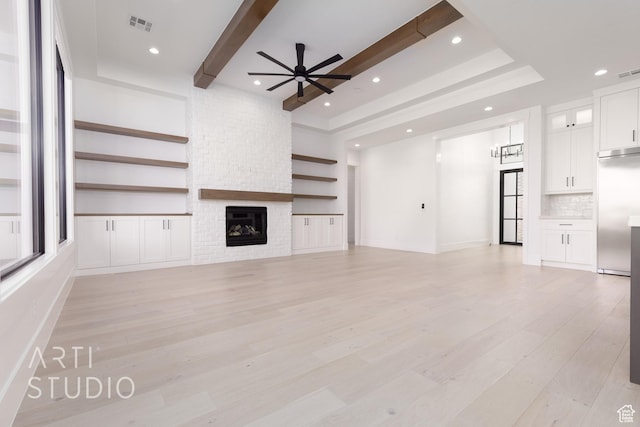 657 E Royal Dr, Washington, UT 84780 - unfurnished living room featuring ceiling fan, light wood-type flooring, a fireplace, beam ceiling, and recessed lighting