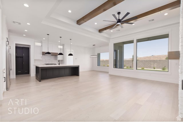 657 E Royal Dr, Washington, UT 84780 - unfurnished living room featuring light wood-style floors, a ceiling fan, recessed lighting, and beamed ceiling