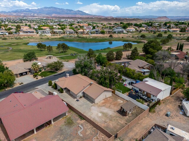 aerial view of residential area with a water and mountain view and a golf club