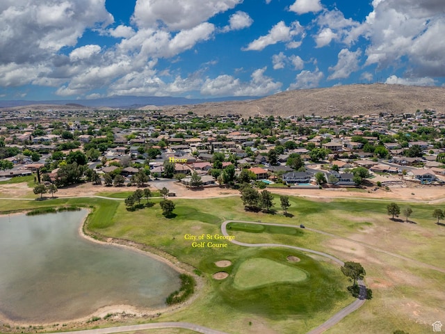 aerial perspective of suburban area featuring a water and mountain view and a golf course