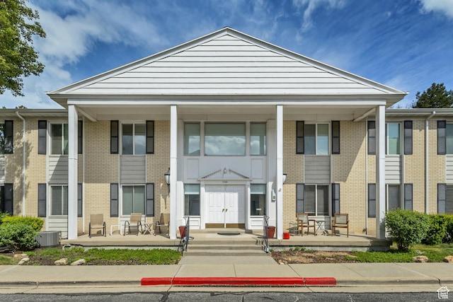 view of building exterior with cooling unit