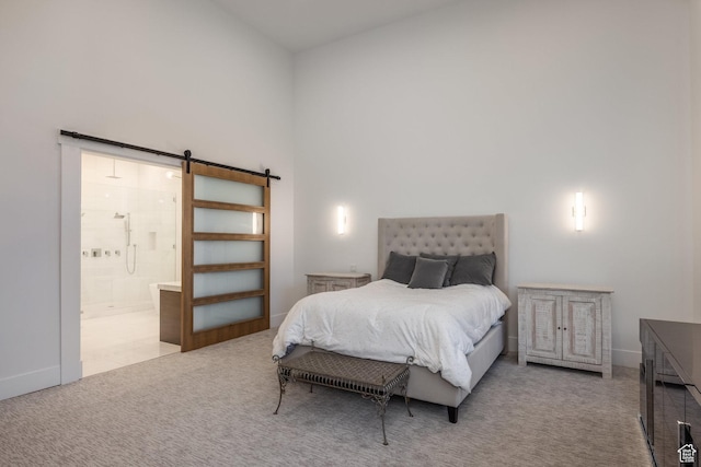 9969 S Altamont Dr E, Sandy, UT 84092 - bedroom with a barn door, carpet, high vaulted ceiling, baseboards, and connected bathroom