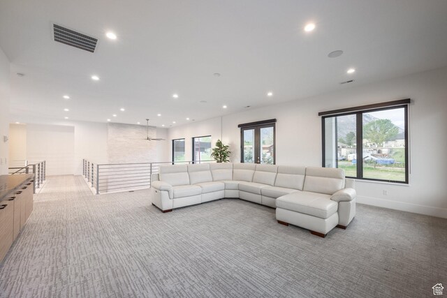 9969 S Altamont Dr E, Sandy, UT 84092 - living area with light carpet, recessed lighting, and plenty of natural light