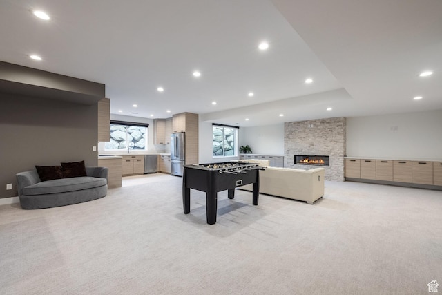 9969 S Altamont Dr E, Sandy, UT 84092 - playroom featuring light carpet, a stone fireplace, and recessed lighting