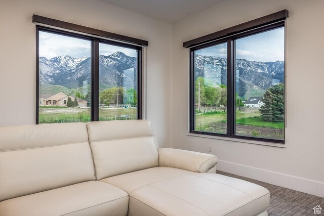 9969 S Altamont Dr E, Sandy, UT 84092 - living area featuring healthy amount of natural light, a mountain view, and baseboards