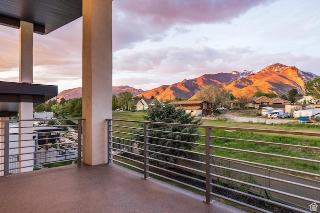 9969 S Altamont Dr E, Sandy, UT 84092 - balcony at dusk featuring a mountain view and a residential view