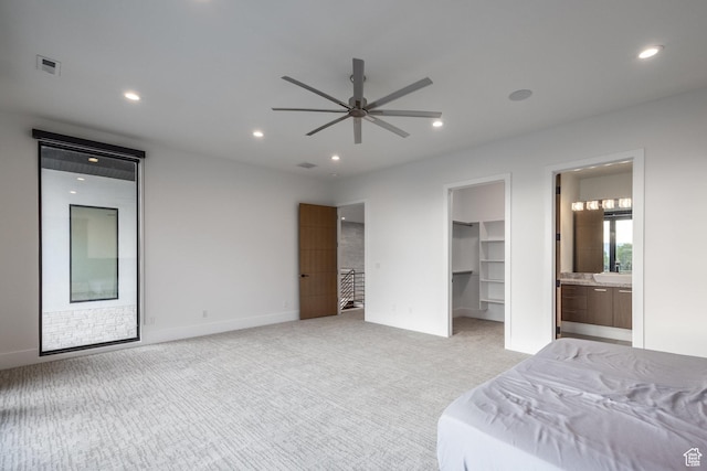 9969 S Altamont Dr E, Sandy, UT 84092 - bedroom featuring light carpet, a spacious closet, recessed lighting, ensuite bath, and baseboards