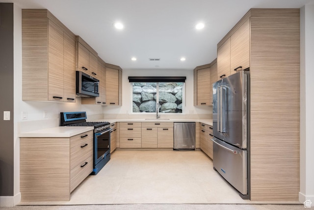 9969 S Altamont Dr E, Sandy, UT 84092 - kitchen featuring appliances with stainless steel finishes, light brown cabinets, light countertops, a sink, and recessed lighting