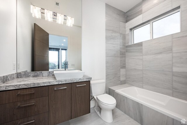 9969 S Altamont Dr E, Sandy, UT 84092 - bathroom featuring toilet, a bath, and vanity