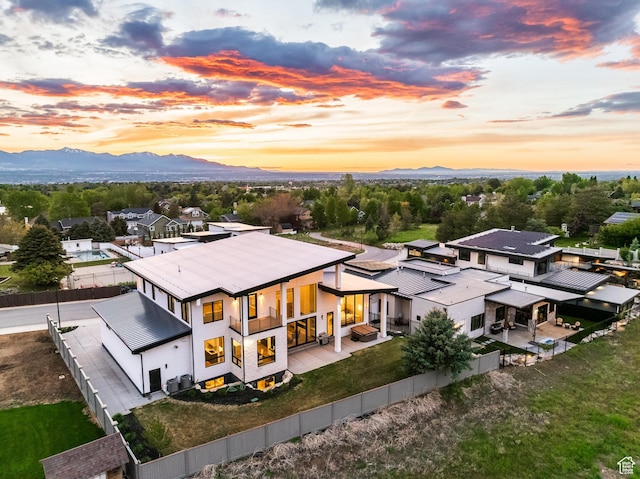 9969 S Altamont Dr E, Sandy, UT 84092 - aerial view at dusk of a mountain view and a residential view
