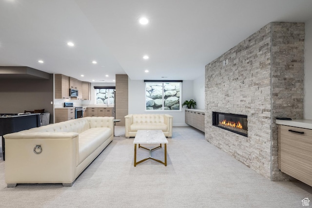 9969 S Altamont Dr E, Sandy, UT 84092 - living area featuring recessed lighting, a fireplace, and light carpet