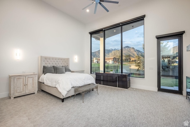 9969 S Altamont Dr E, Sandy, UT 84092 - carpeted bedroom featuring access to exterior, multiple windows, baseboards, a ceiling fan, and recessed lighting