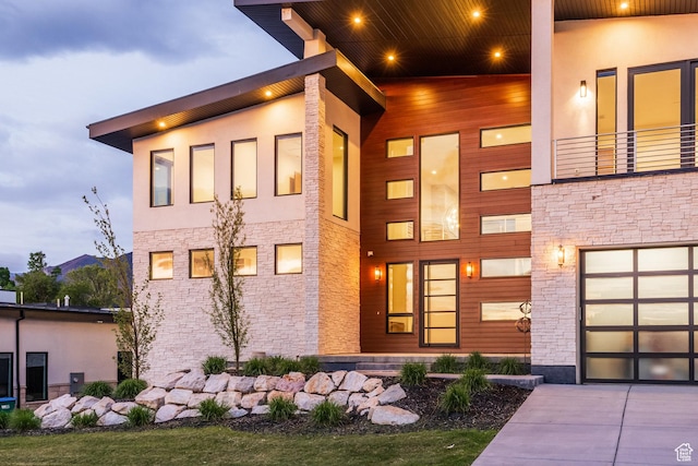 9969 S Altamont Dr E, Sandy, UT 84092 - modern home featuring stone siding and driveway