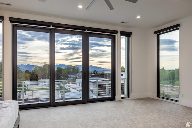 9969 S Altamont Dr E, Sandy, UT 84092 - doorway to outside featuring ceiling fan, carpet flooring, a mountain view, recessed lighting, and baseboards