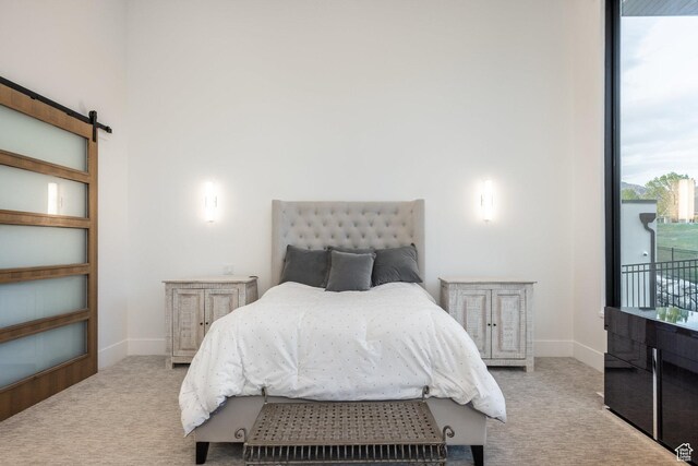 9969 S Altamont Dr E, Sandy, UT 84092 - bedroom featuring carpet floors, a barn door, and baseboards