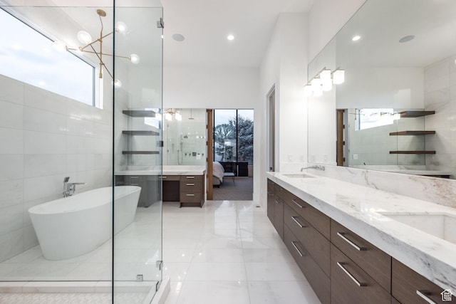 9969 S Altamont Dr E, Sandy, UT 84092 - ensuite bathroom with double vanity, a stall shower, a freestanding bath, recessed lighting, and a chandelier