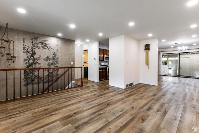 1950 S 200 W Unit B12, Bountiful, UT 84010 - spare room with a chandelier, wood finished floors, recessed lighting, and baseboards