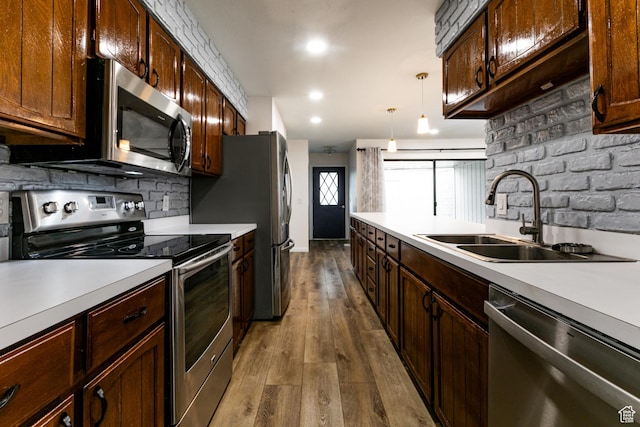 1950 S 200 W Unit B12, Bountiful, UT 84010 - kitchen with appliances with stainless steel finishes, a sink, light countertops, dark wood-type flooring, and recessed lighting