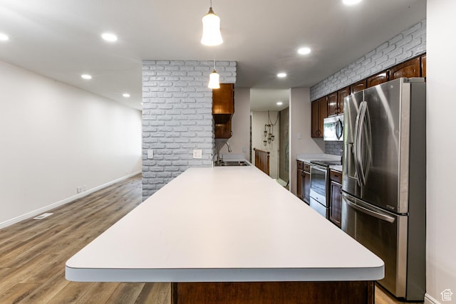 1950 S 200 W Unit B12, Bountiful, UT 84010 - kitchen with appliances with stainless steel finishes, a sink, light wood-style floors, light countertops, and recessed lighting