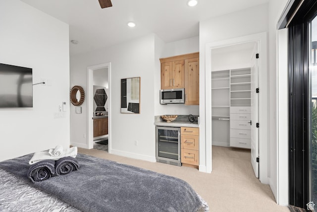 1450 W Torrey Pines Rd, Hurricane, UT 84737 - bedroom with beverage cooler, light colored carpet, a spacious closet, recessed lighting, and a closet