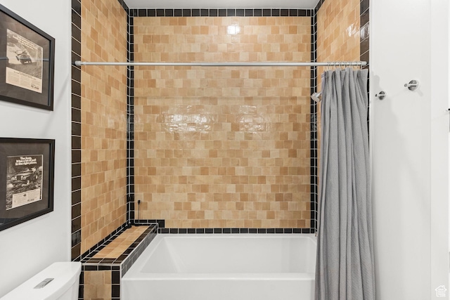 bathroom featuring shower / bathtub combination with curtain and toilet
