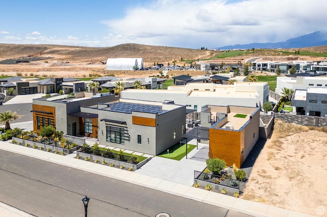 aerial view of residential area with mountains