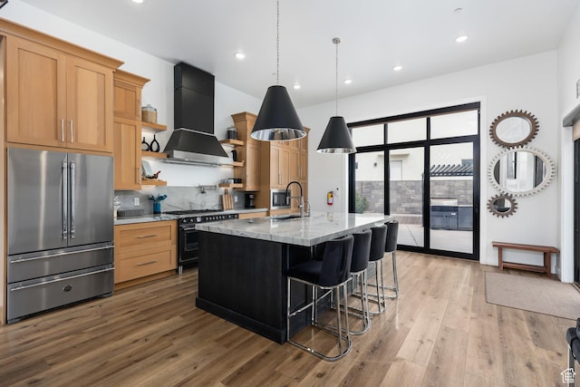 1450 W Torrey Pines Rd, Hurricane, UT 84737 - kitchen featuring premium appliances, wall chimney range hood, open shelves, light wood-style floors, and decorative backsplash