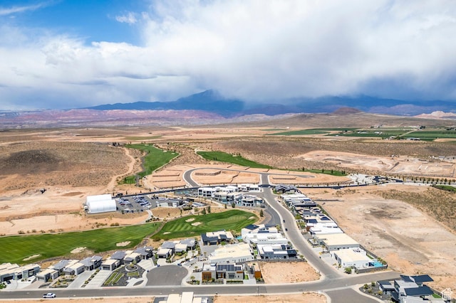 aerial view of property's location featuring a mountain backdrop