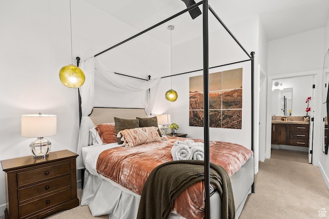 1450 W Torrey Pines Rd, Hurricane, UT 84737 - bedroom featuring light colored carpet and connected bathroom