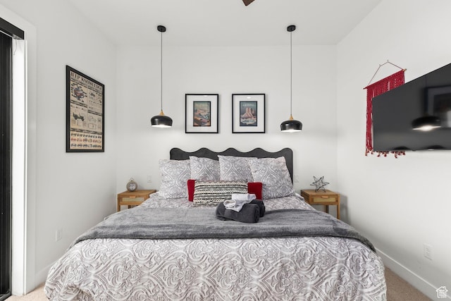 carpeted bedroom with baseboards