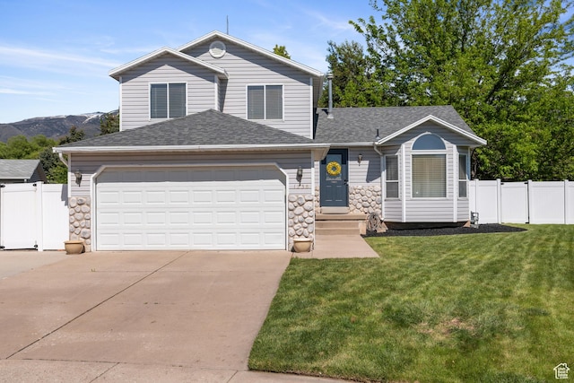 traditional-style house with concrete driveway, a shingled roof, a garage, and stone siding