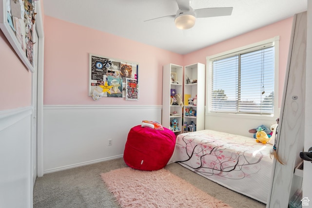 bedroom featuring carpet floors, a ceiling fan, and baseboards