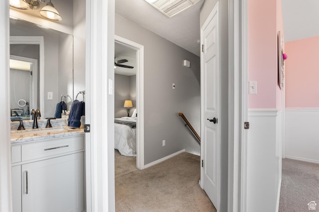 bathroom with vanity and baseboards