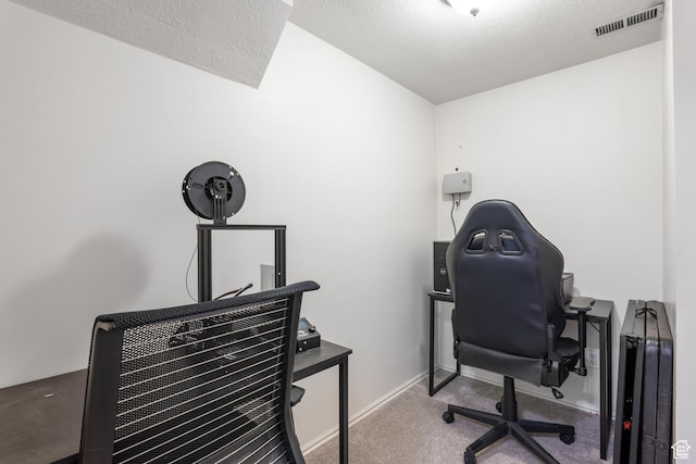 carpeted office featuring baseboards