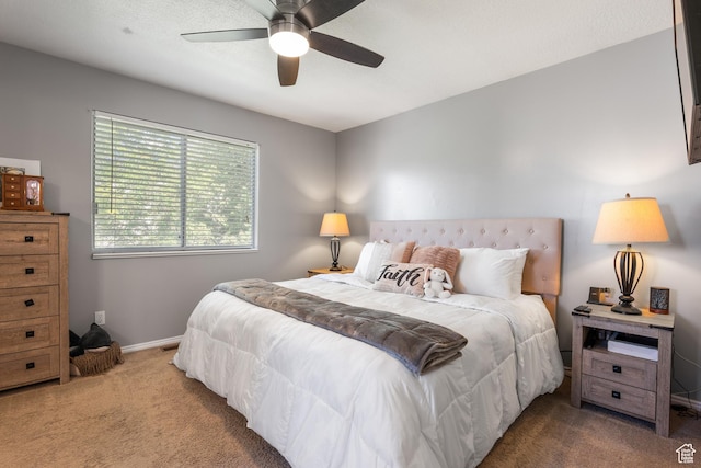 bedroom featuring carpet flooring, baseboards, and a ceiling fan