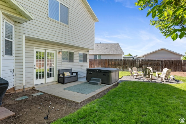 view of yard with a hot tub and a patio