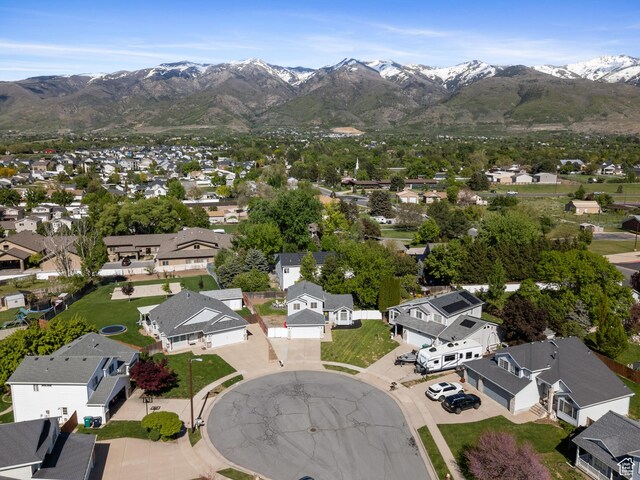 aerial view of residential area featuring mountains