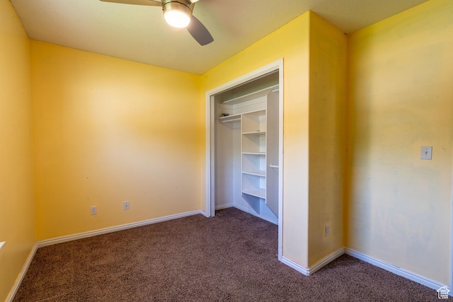 unfurnished bedroom with carpet flooring, baseboards, and a ceiling fan
